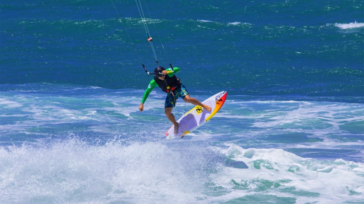 Riding waves kitesurfing